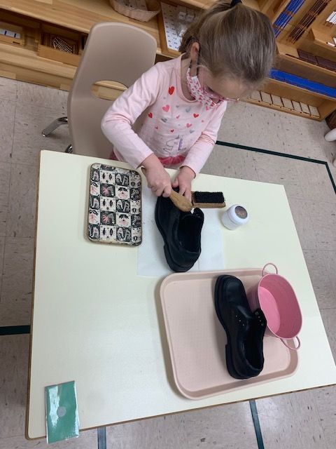 Polishing shoe is a Practical Life exercise that promotes self care. This child is able to remember the steps for polishing which helps increase her logical sen